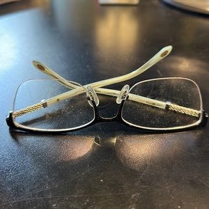 Used Tiffany brand blue eyeglass frame with prescription lenses.
